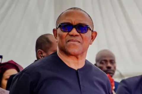 Peter Obi at an event, with supporters around